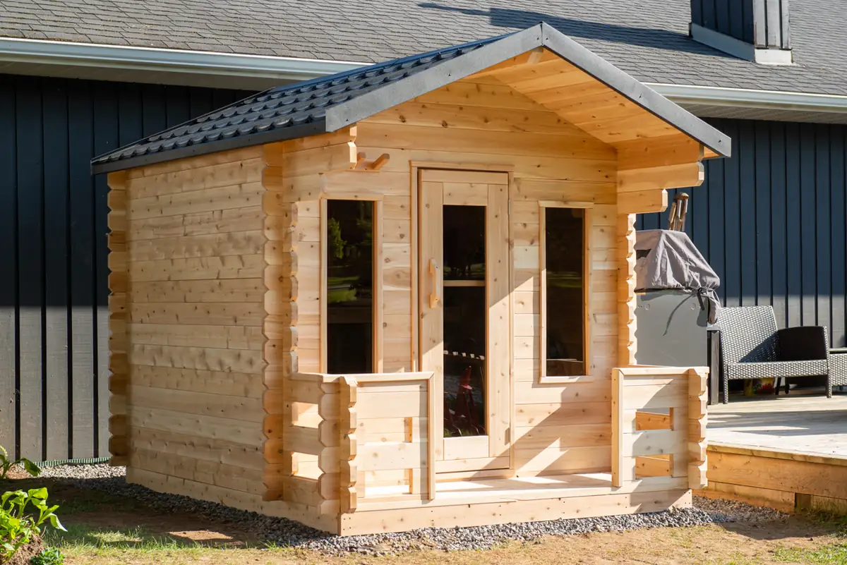 CT Georgian Cabin Sauna in eastern white cedar with a gable roof and a covered front porch
